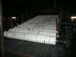 Coke grill separator with wear resistant ceramics shafts